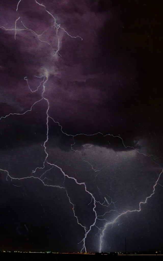 Restore-R1 output: the same lightning photograph with the rain streaks and noise removed.